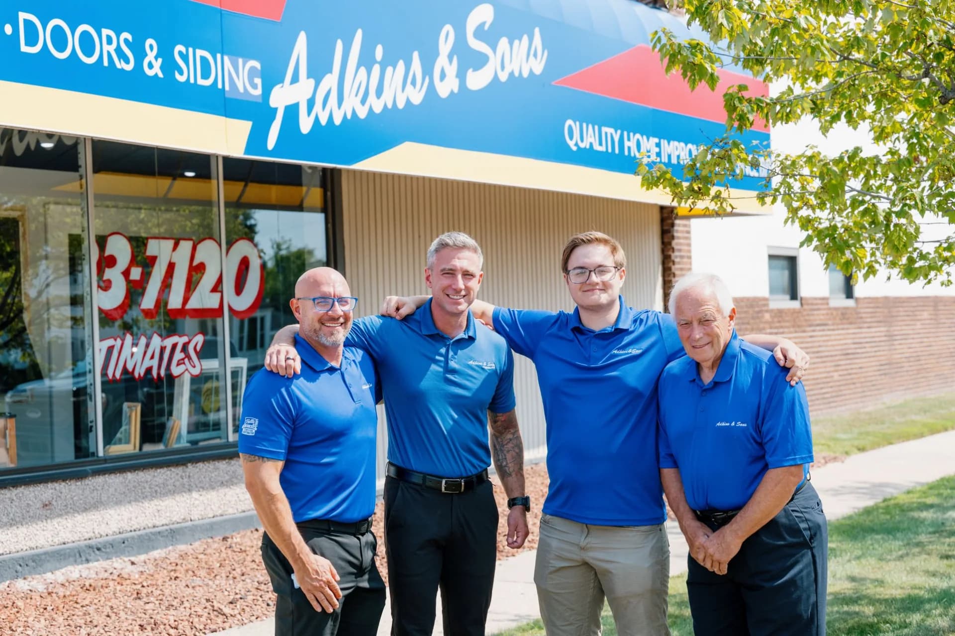 Kyle Adkins Jr., Phil Adkins, Owen Adkins and Kyle Adkins Sr. outside the Adkins & Sons showroom in Southgate