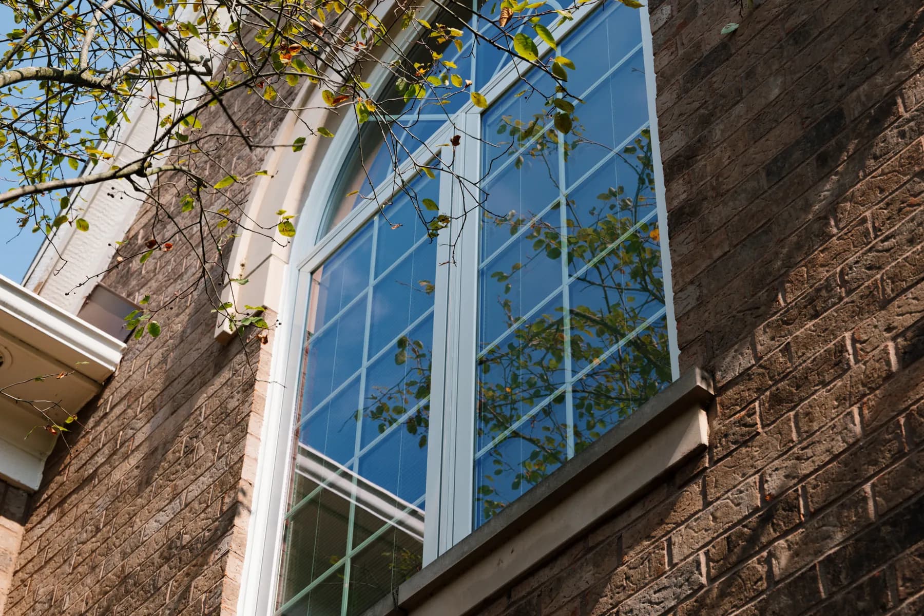 Arch-top replacement window with grids, Ann Arbor