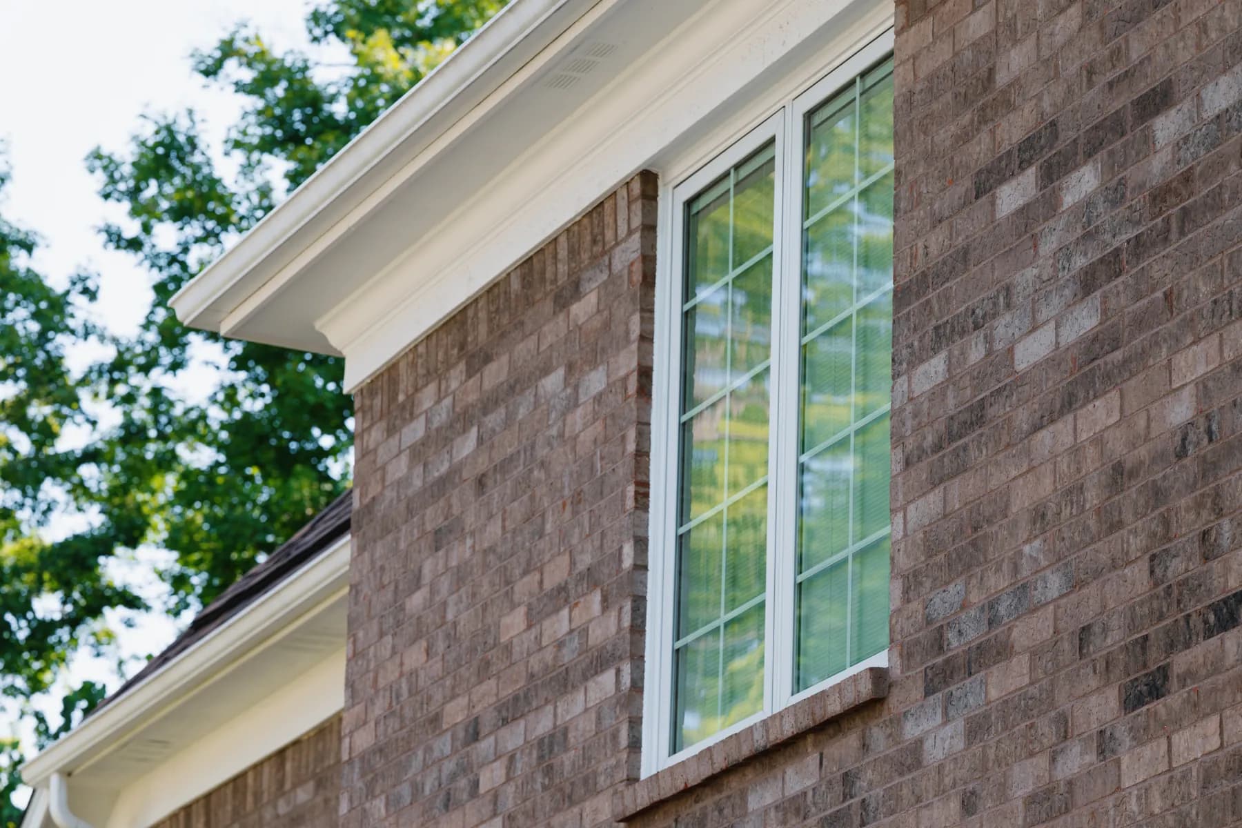 Tall grid window under the gable cornice, Ann Arbor