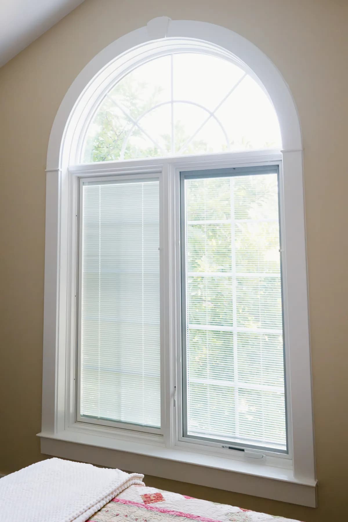 Arched casement window in an Ann Arbor bedroom