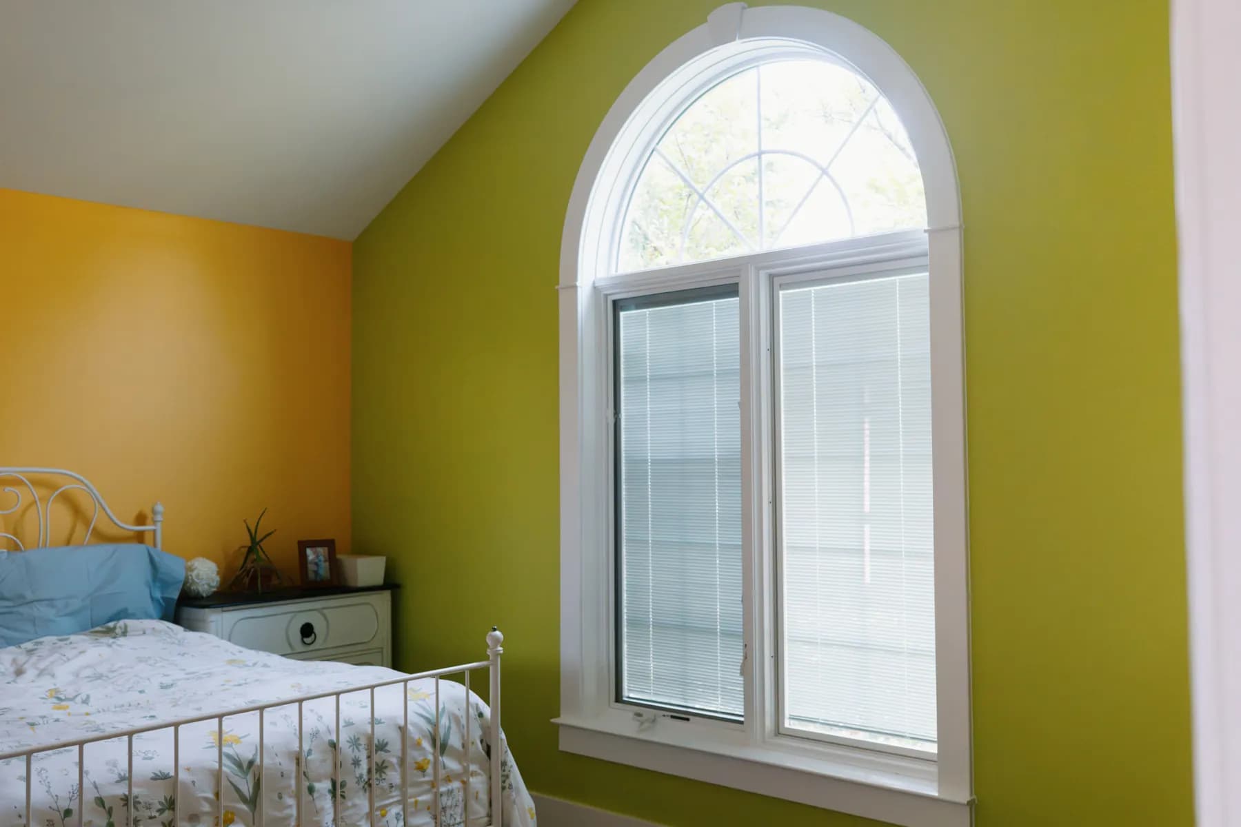 Arched window brightening a bedroom, Ann Arbor