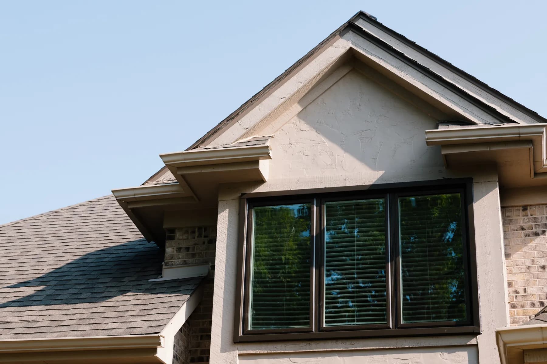 Hip-roof dormer with a new black-framed window, Canton