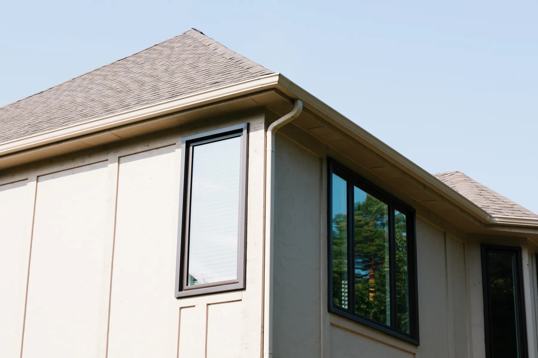 Black-framed windows set in stucco on a Canton contemporary