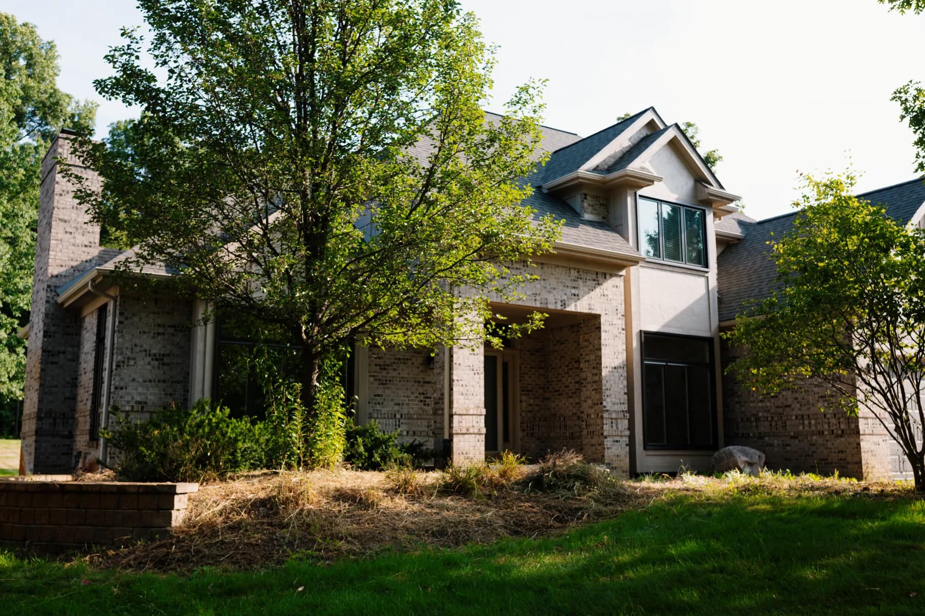 Full front elevation with the windows replaced on a brick two-storey in Livonia