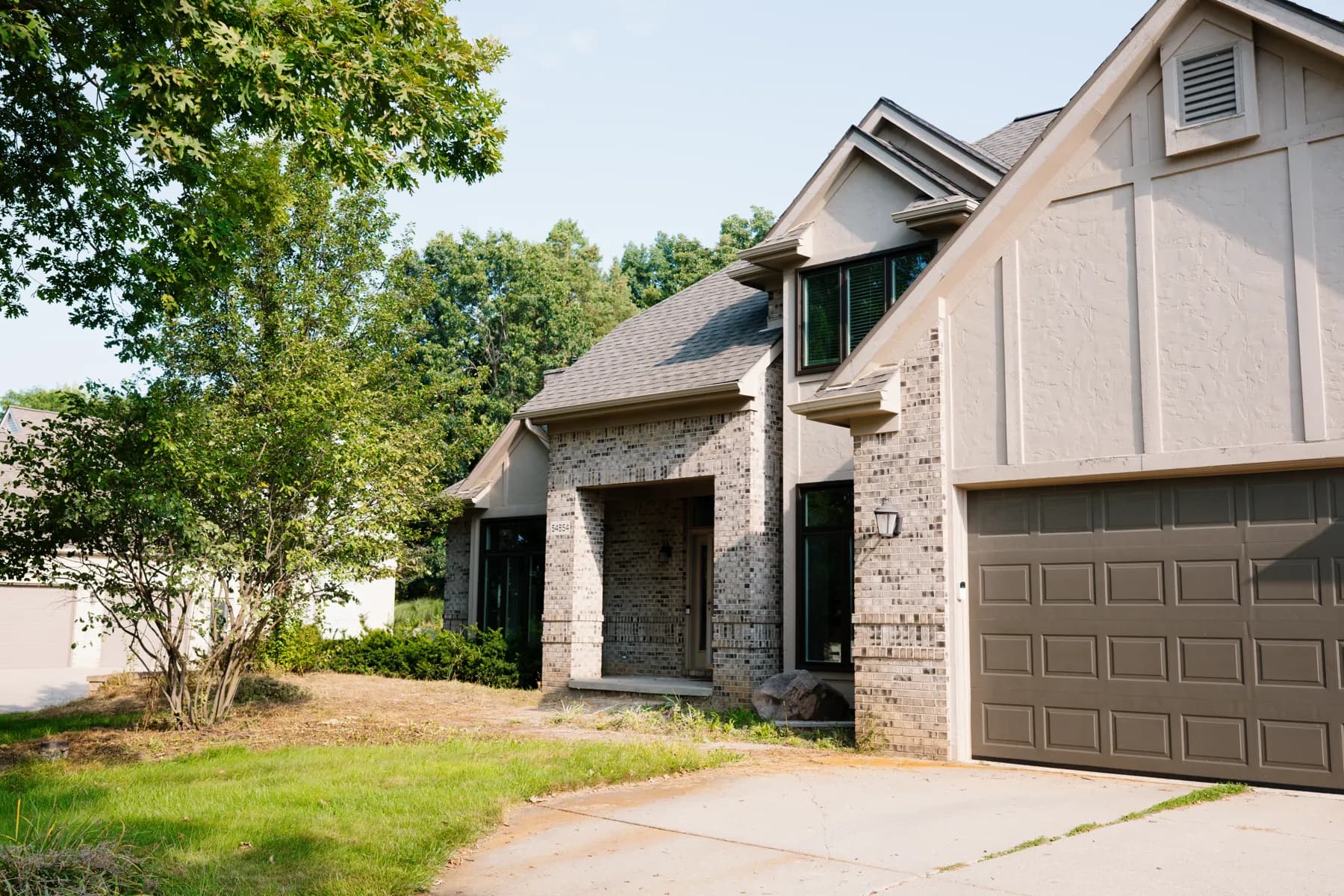 Brick and stucco two-storey with new windows and garage, Livonia