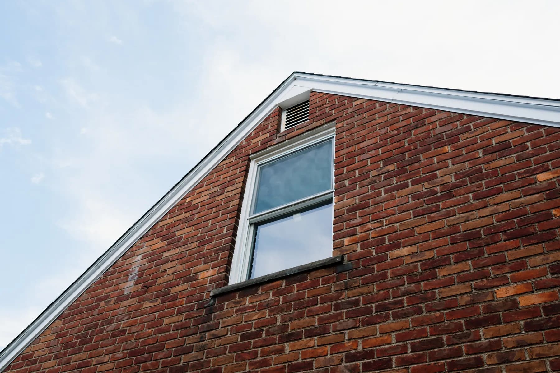 Gable-end window on a brick home in Southgate