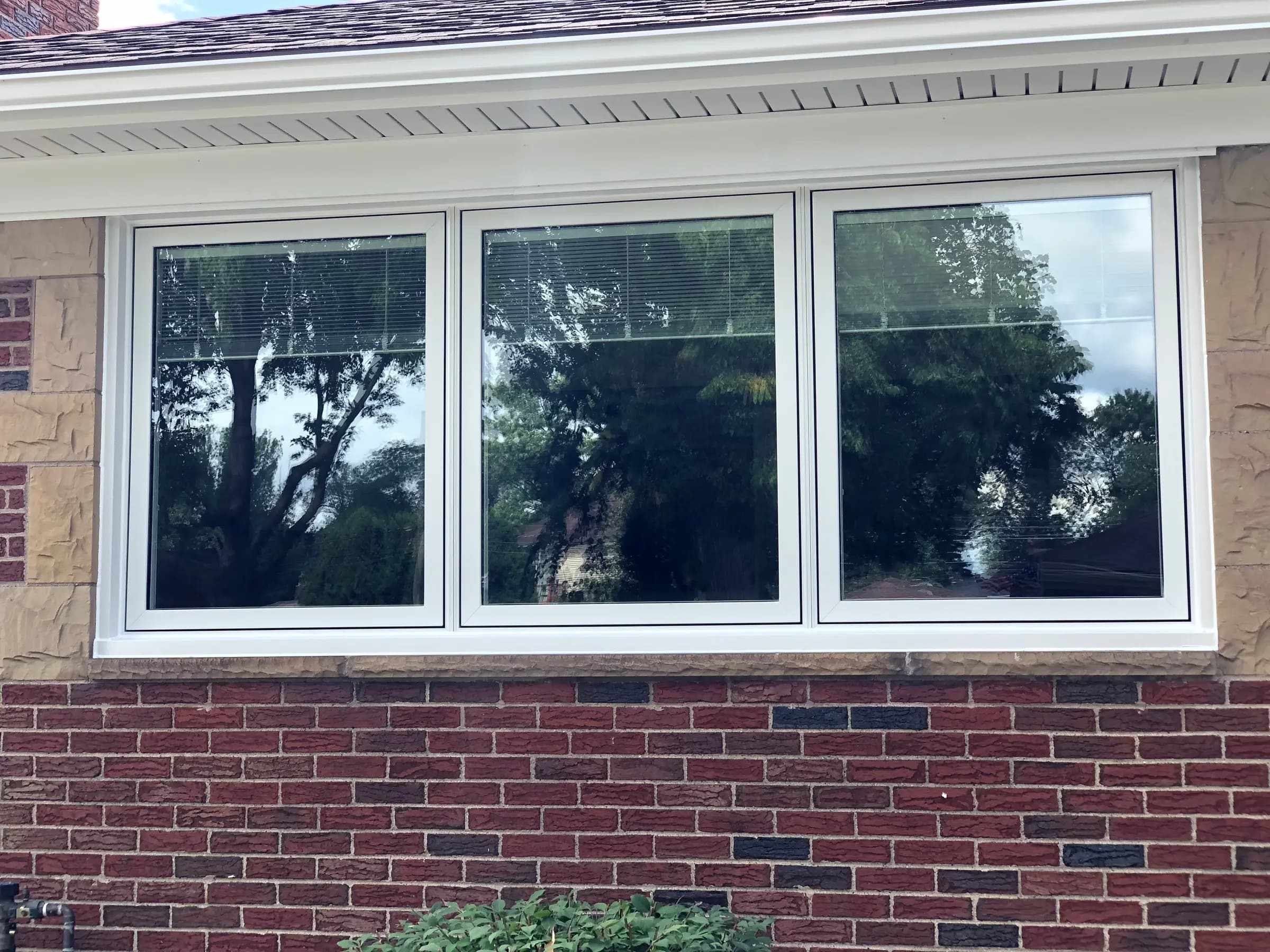 Wide picture-window band in a red brick wall
