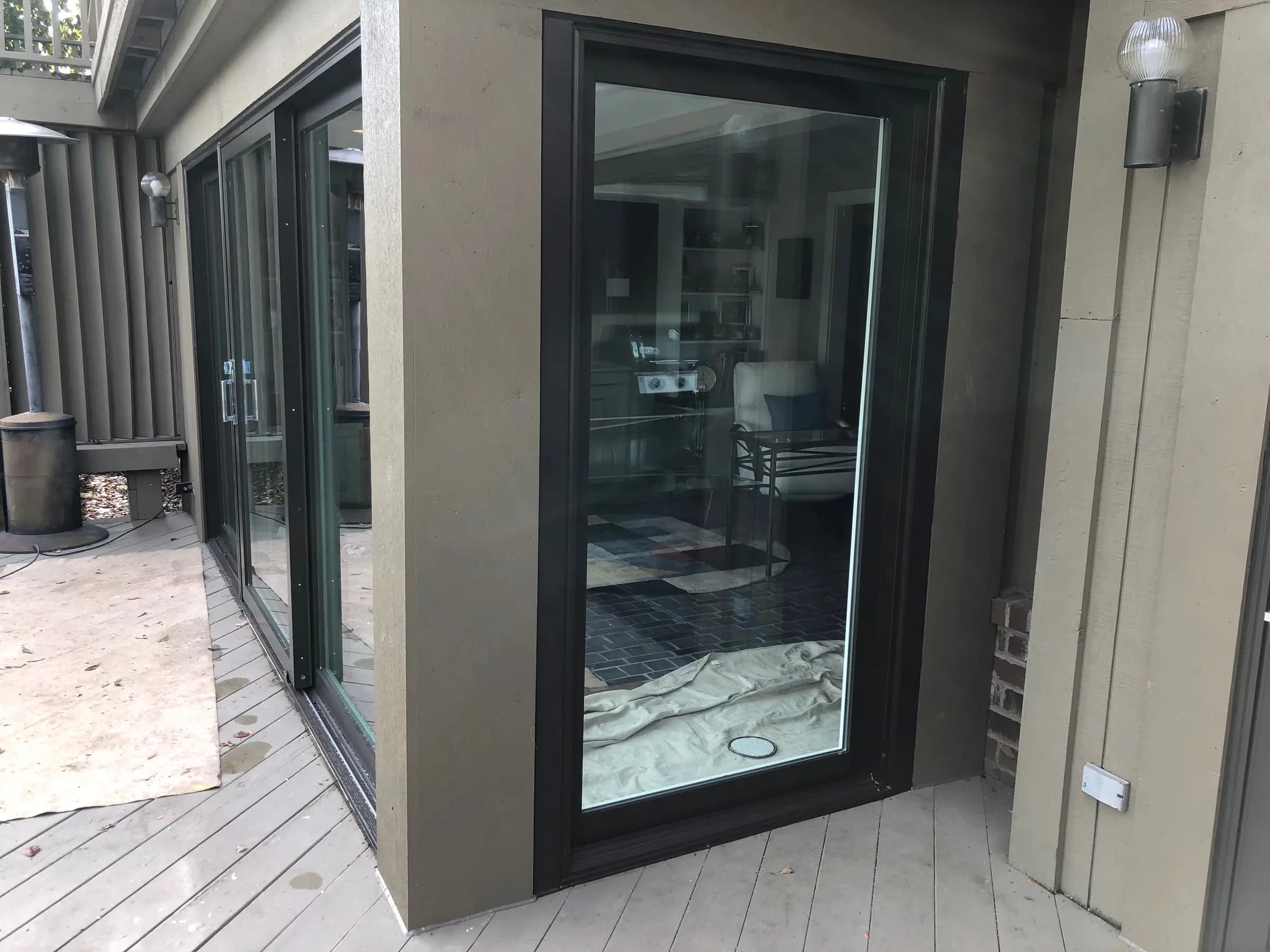 New patio door set into a deck-side wall during installation