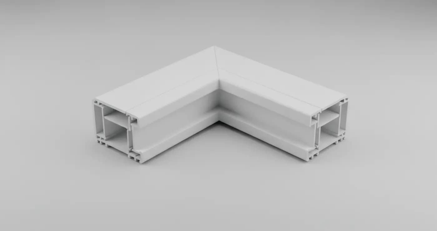 An L-shaped corner cut from a white vinyl window frame, the two legs joined on a single continuous welded mitre with the hollow chambers visible at each cut end