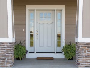 A custom white front door with sidelights