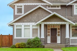 Beautiful new vinyl windows installed on a two-story home