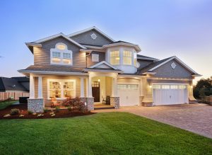 Beautiful luxury two-story home with lap siding and multiple window styles